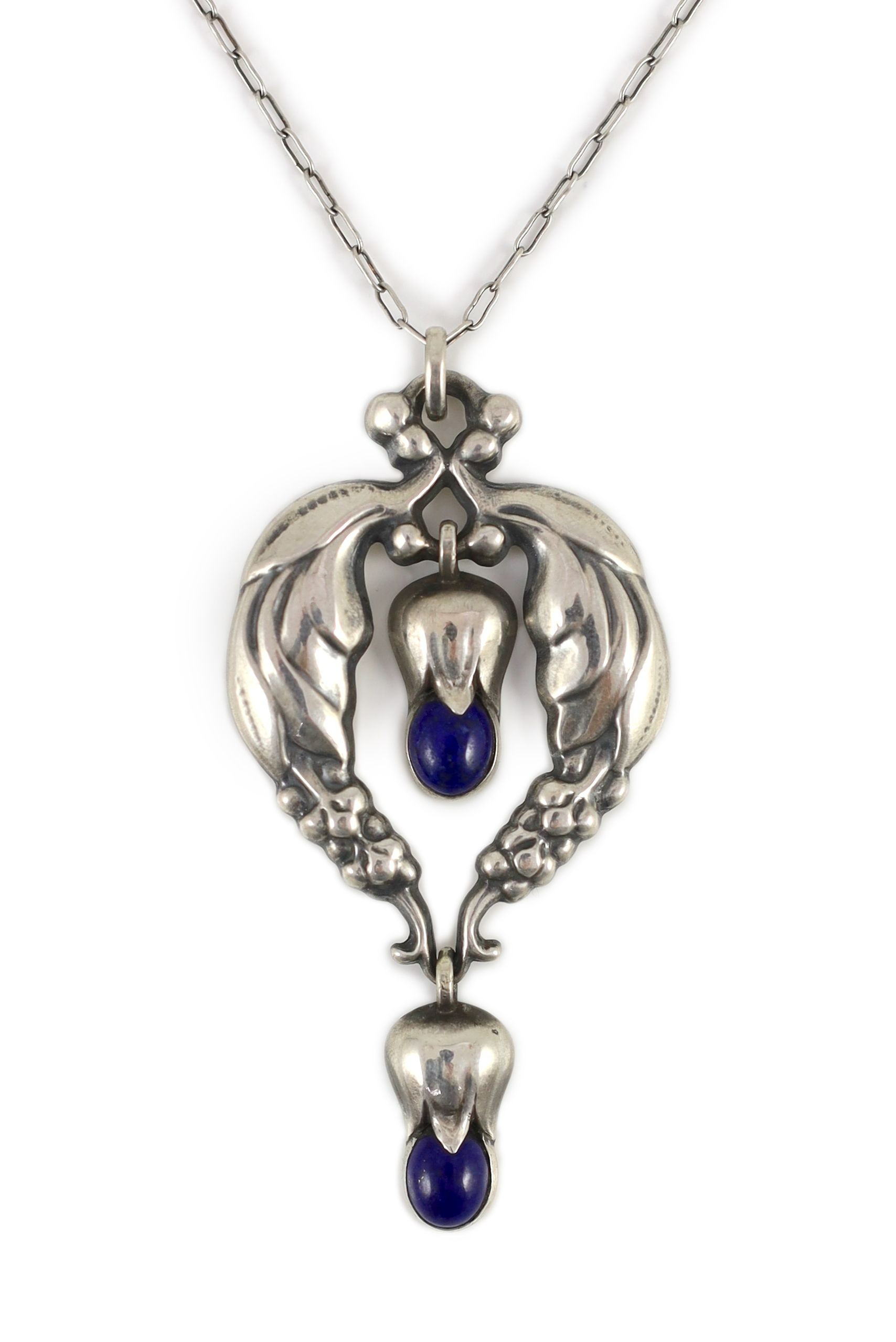 A 1920's George Jensen sterling silver and two stone lapis lazuli set drop pendant, design no. 51